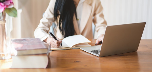 woman-writing-on-notebook-3803242-1.jpg